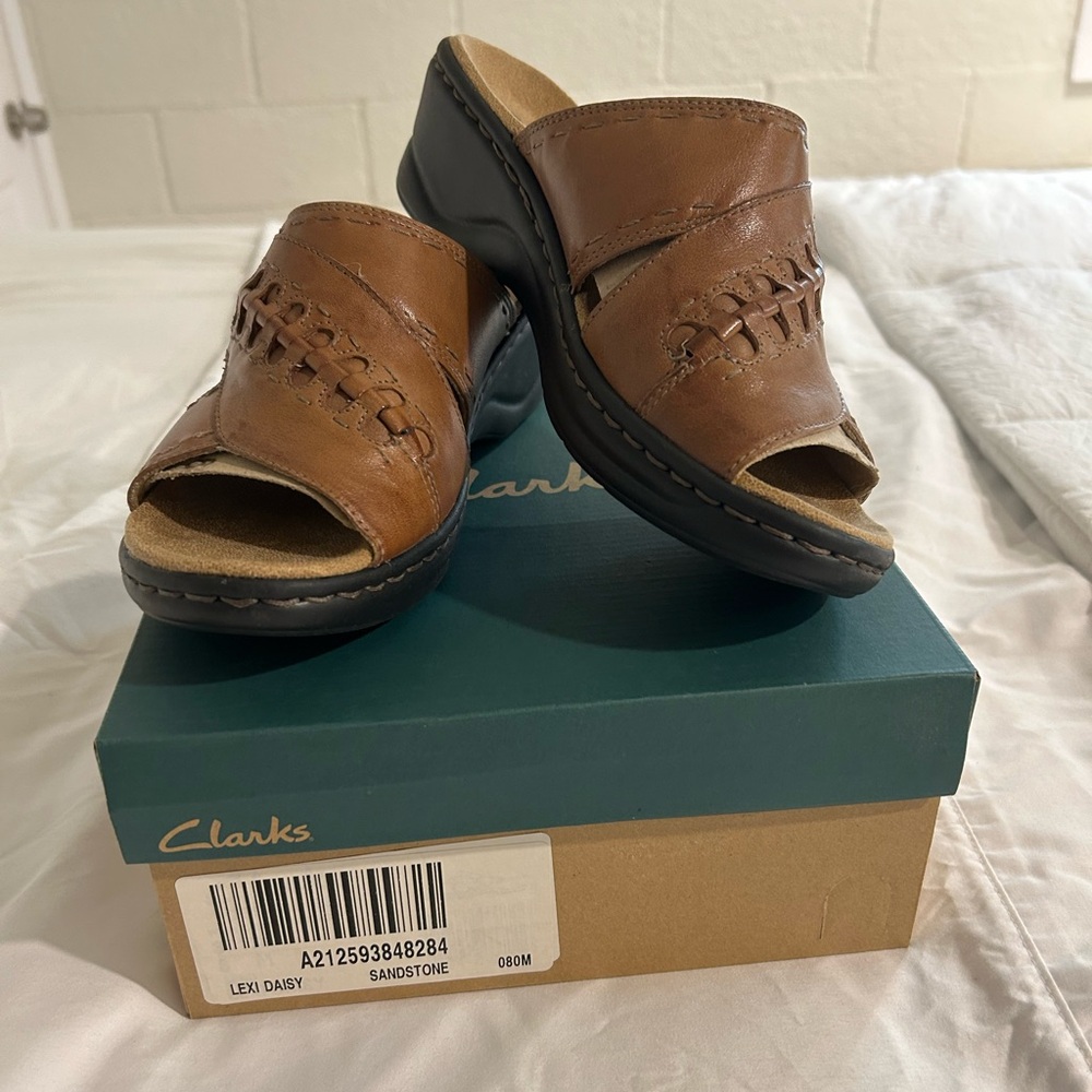 NWOT with box women’s size 8 brown sandals.